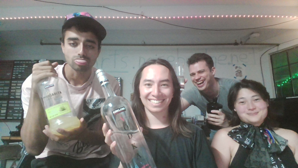 A group picture of Noisebridgers holding alchohol